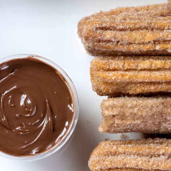 Don Juan Mex Grill churros, coated in cinnamon sugar, with a side of rich chocolate dipping sauce.