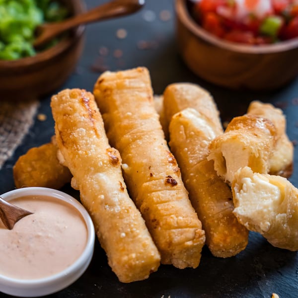 Don Juan Mex Grill's golden-fried cheese sticks with a side of creamy dipping sauce, salsa, and guacamole.