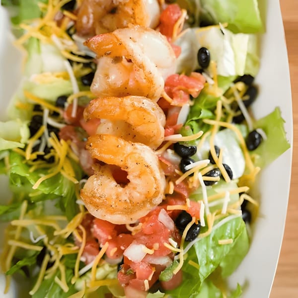 Don Juan Mex Grill's shrimp salad with lettuce, tomatoes, black beans, cheese, and sour cream.